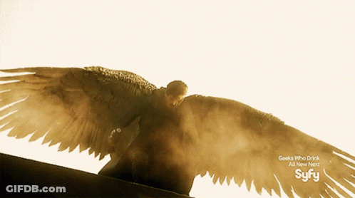 An Advertisement For Syfy Shows A Man With Wings Spread GIF