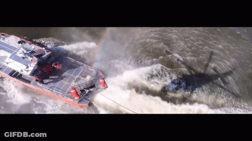 An Aerial View Of A Boat Going Through A Body Of Water GIF