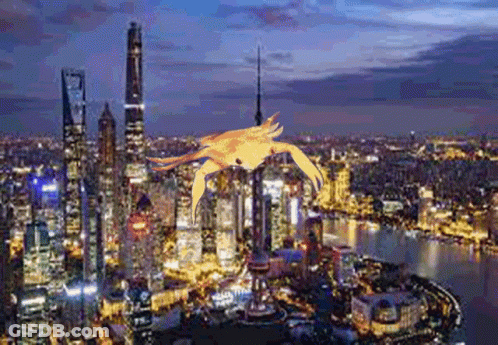 An Aerial View Of A City At Night With A Crab Flying Over It GIF