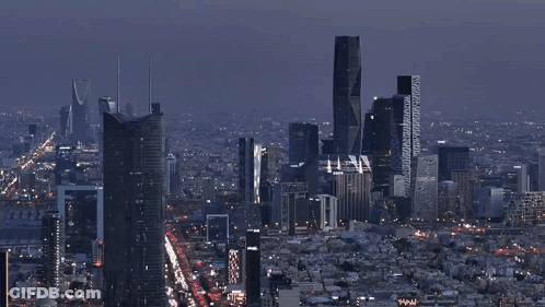 An Aerial View Of A City At Night With A Few Buildings That Say ' Www ' On Them GIF