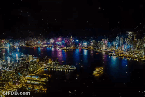 An Aerial View Of A City At Night With A Lot Of Lights GIF