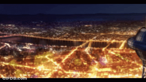 An Aerial View Of A City At Night With Lots Of Lights GIF