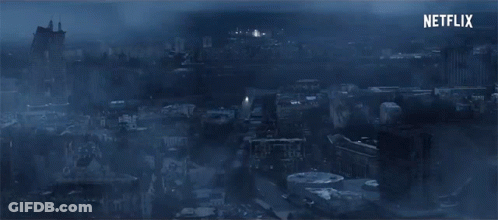 An Aerial View Of A City At Night With Netflix Written In The Corner GIF