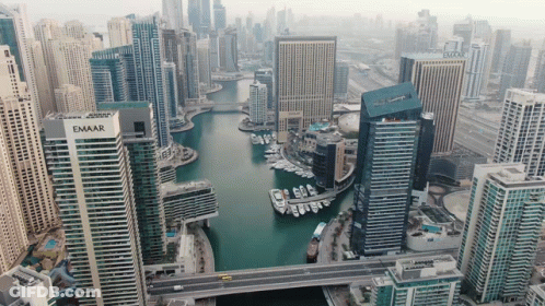 An Aerial View Of A City With A Building That Has The Word Emaar On It GIF