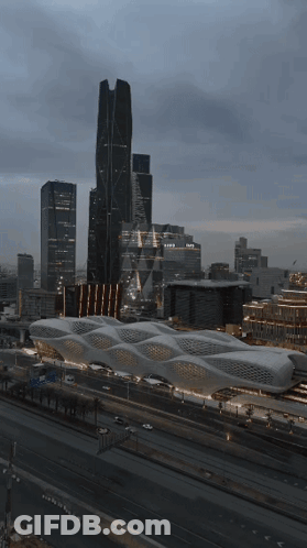An Aerial View Of A City With A Large Building That Says Expo On It GIF