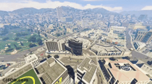 An Aerial View Of A City With A Large Building With The Letter G On The Roof GIF