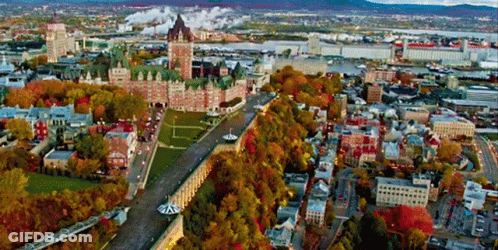An Aerial View Of A City With A Large Castle In The Center GIF