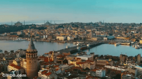 An Aerial View Of A City With A Large Tower In The Middle GIF