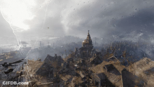 An Aerial View Of A City With A Tower In The Background GIF