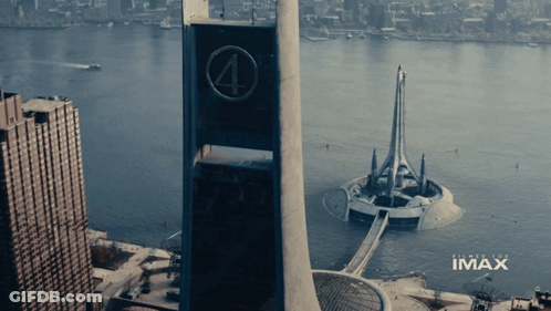 An Aerial View Of A City With Imax Written On The Bottom GIF