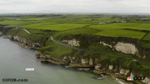 An Aerial View Of A Cliff With A Sign That Says ' The Open ' On It GIF