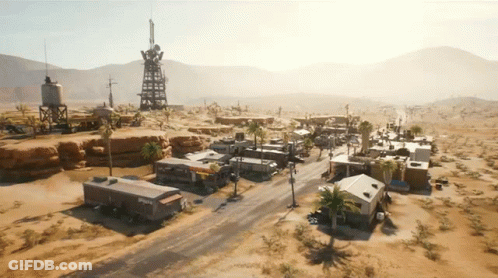 An Aerial View Of A Desert Landscape With A Few Buildings And A Water Tower With The Word Phoenix On It GIF
