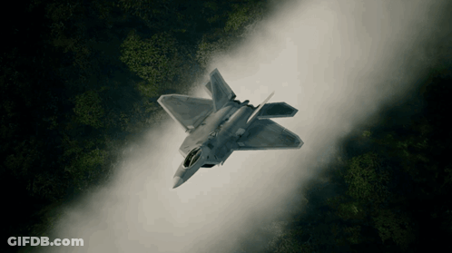 An Aerial View Of A Fighter Jet Flying Through The Air GIF