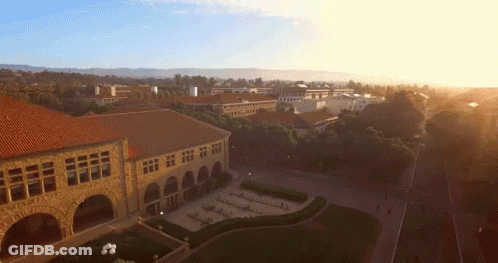 An Aerial View Of A Large Building With Arches GIF