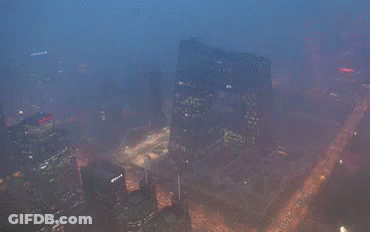 An Aerial View Of A Large City At Night GIF