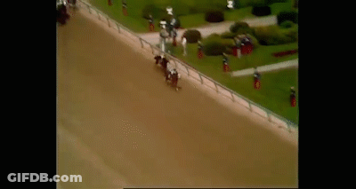 An Aerial View Of A Race Track With Horses And Jockeys . GIF