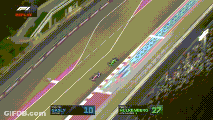 An Aerial View Of A Race Track With The Numbers 10 And 27 On The Screen GIF