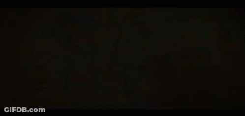 An Aerial View Of A River Surrounded By Mountains And Trees . GIF