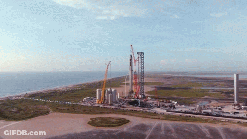 An Aerial View Of A Rocket Being Built On The Beach GIF
