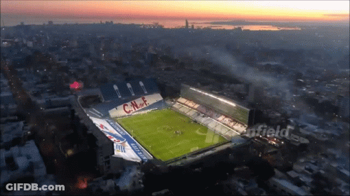 An Aerial View Of A Soccer Stadium With The Letters Cnf On The Side GIF