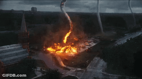 An Aerial View Of A Tornado That Is Coming Down A Hill GIF