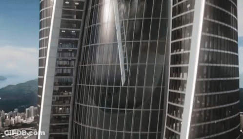 An Aerial View Of A Very Tall Building With A Clock On The Top Of It GIF