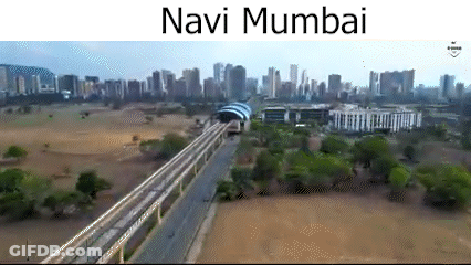 An Aerial View Of Navi Mumbai With A Train Going Through The City GIF