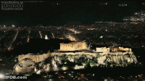 An Aerial View Of The Acropolis At Night With The Words #Acropolis 00:00:00 Nearth Hour On The Bottom GIF