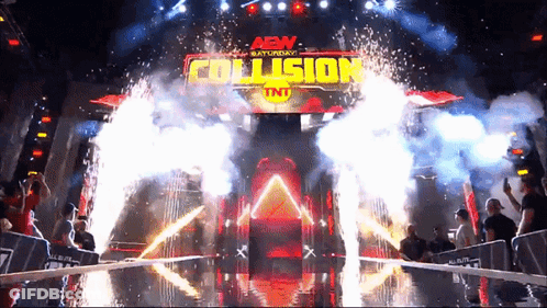 An Aew Saturday Collision Tnt Event With Fireworks Coming Out Of It GIF