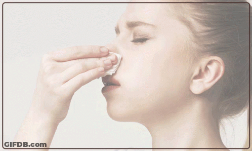 An Air Purifier For Allergies Is Advertised With A Woman Holding A Cat GIF
