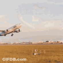 An Airitalia Plane Is Flying Through The Sky GIF