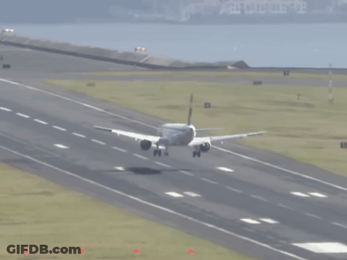 An Airplane Is Taking Off From A Runway With The Number 8 On The Right Side GIF