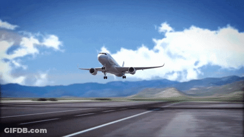 An Airplane Taking Off From An Airport Runway With Mountains In The Background GIF