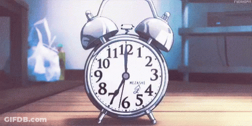 An Alarm Clock Is Sitting On A Wooden Floor And Shows The Time As 4:20 GIF