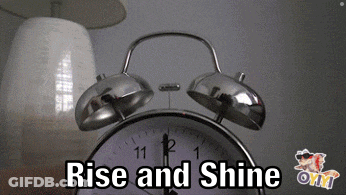 An Alarm Clock With The Words Rise And Shine Written On It GIF