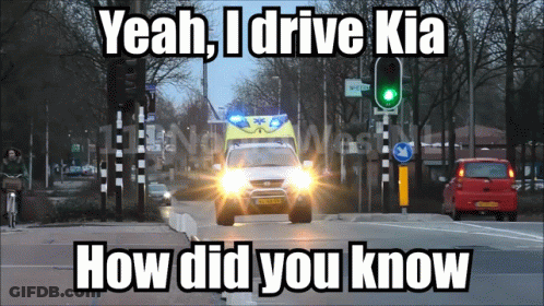An Ambulance Is Driving Down A Street With The Words Yeah I Drive Kia How Did You Know GIF