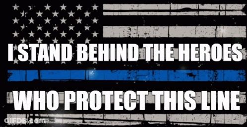 An American Flag With The Words " I Stand Behind The Heroes Who Protect This Line " On It GIF