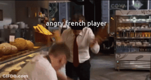 An Angry French Player Is Standing In Front Of A Display Case Of Bread GIF