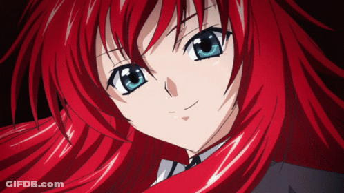 An Anime Girl With Red Hair And Blue Eyes GIF