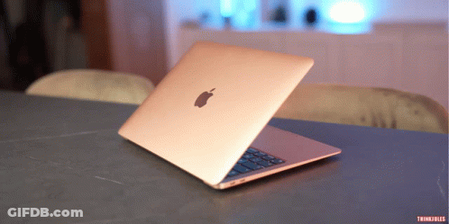 An Apple Laptop Sits Open On A Table With Thinkfiles Written On The Bottom GIF
