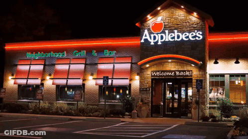 An Applebee 'S Restaurant With A Welcome Back Sign In Front Of It GIF