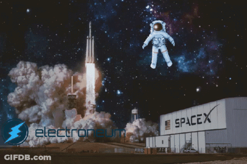 An Astronaut Is Flying Over A Spacex Building With A Rocket In The Background GIF