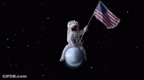 An Astronaut On The Moon With An American Flag Behind Him GIF