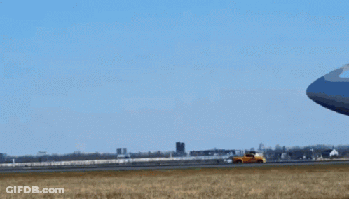 An Atl Airplane Is Taking Off From An Airport Runway GIF