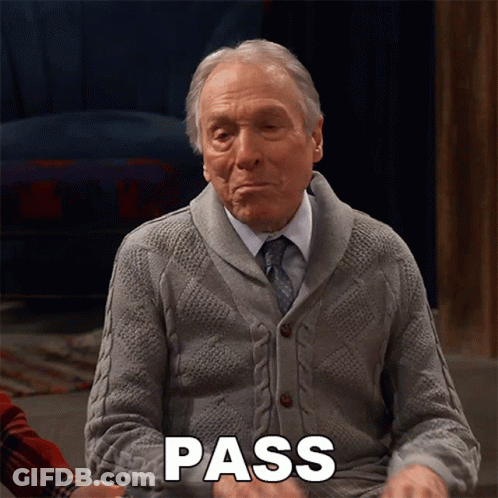An Elderly Man In A Grey Sweater And Tie Is Saying Pass GIF
