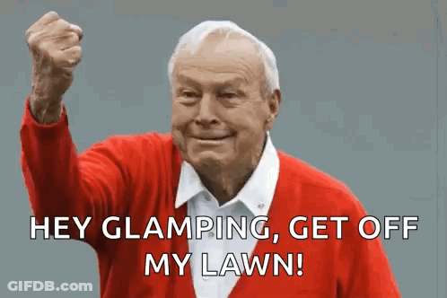 An Elderly Man In A Red Sweater Is Making A Funny Face With His Fist In The Air . GIF