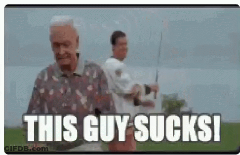 An Elderly Man Is Holding A Fishing Rod And Saying `` This Guy Sucks '' While Another Man Looks On . GIF