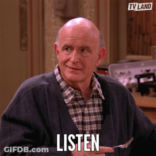 An Elderly Man Is Holding A Fork In His Hand And Says Listen GIF