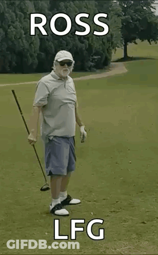 An Elderly Man Is Holding A Golf Club On A Golf Course . GIF