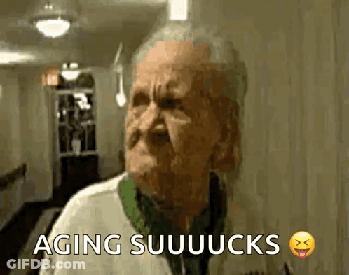 An Elderly Man Is Making A Funny Face And The Words Aging Suuuucks Are Above Him GIF